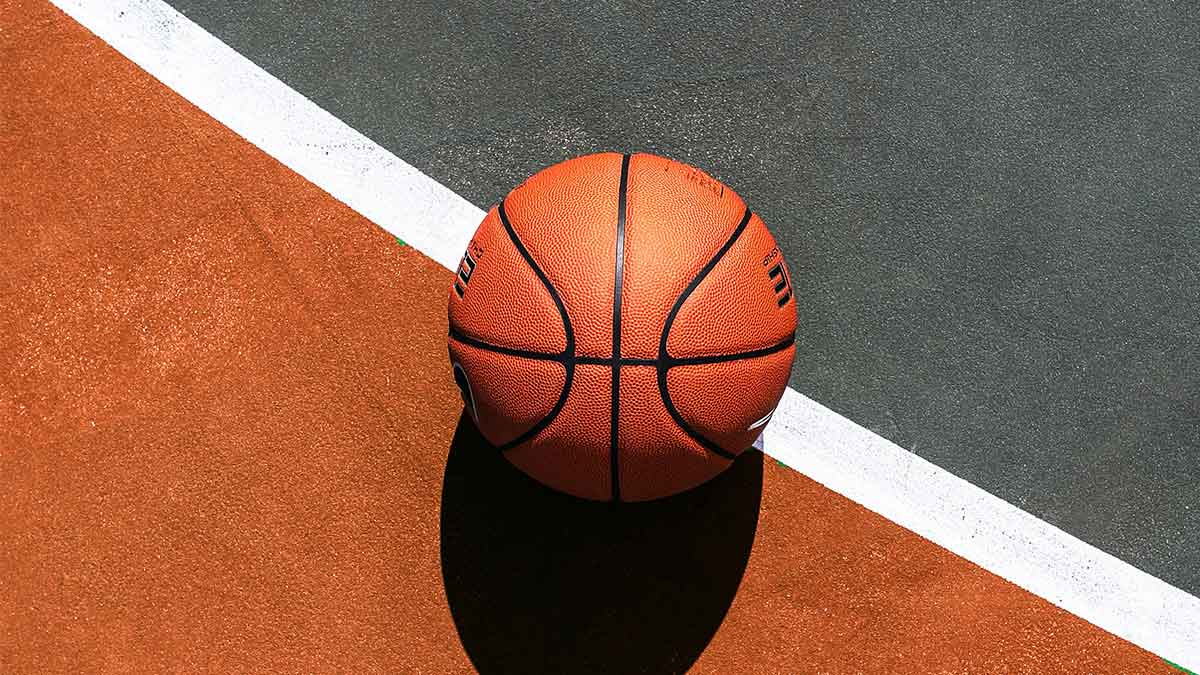 Basketball lying on an outdoor basketball court