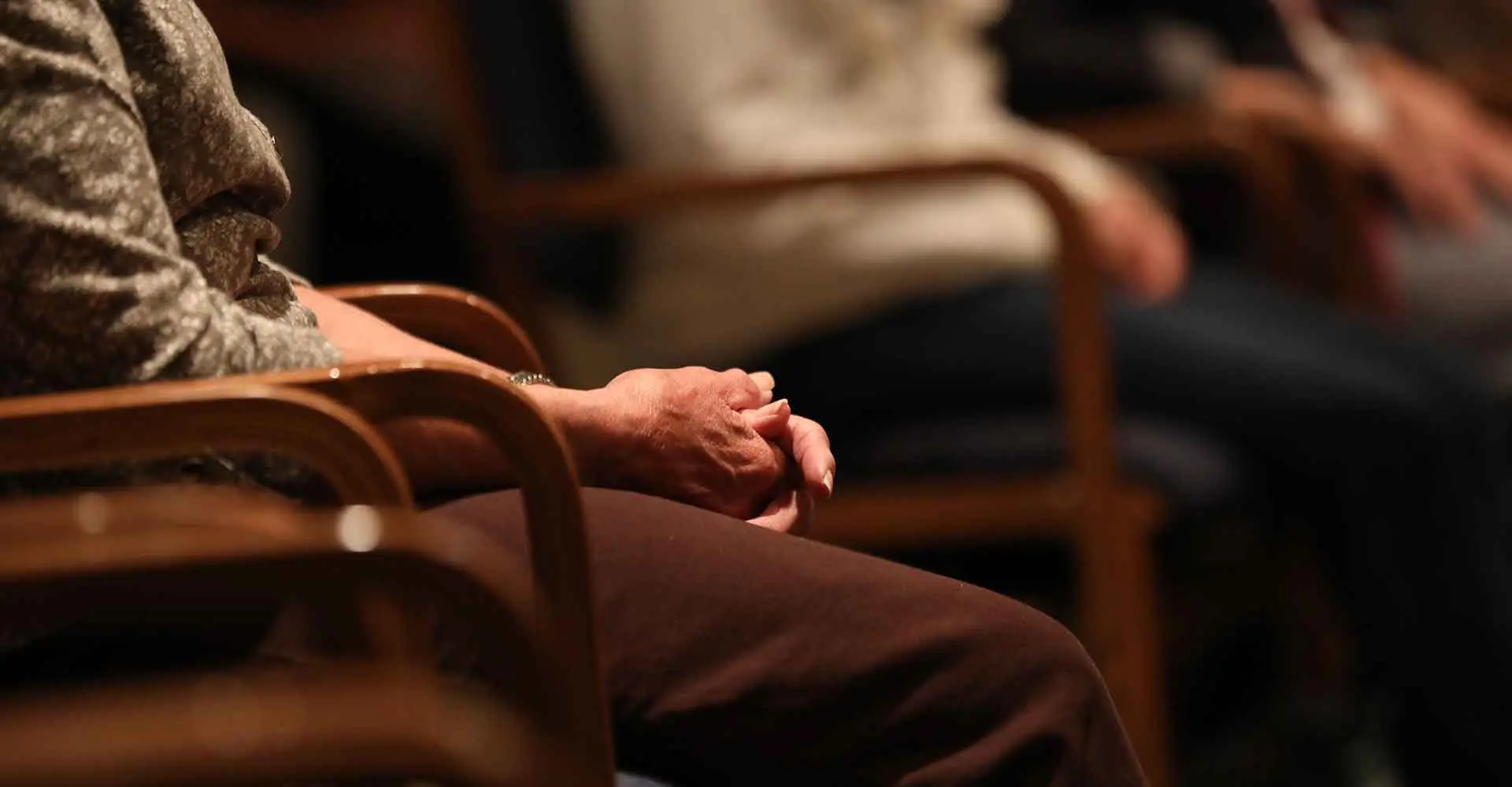 Close-up of a woman's hands in prayer at Capuchin Retreat