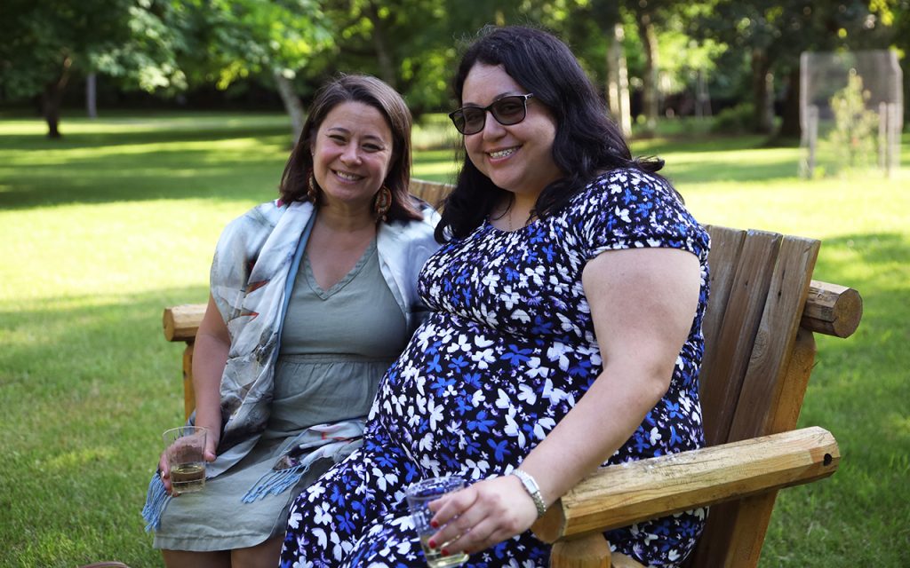 Two volunteers sitting on a bench at Capuchin Retreat